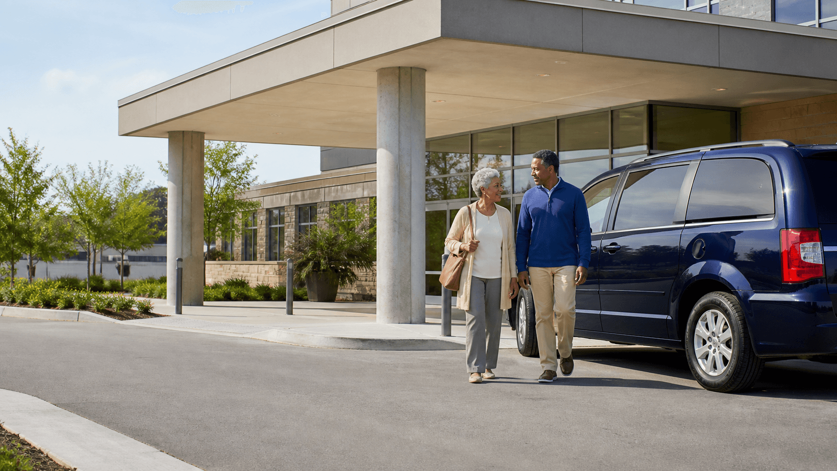 An older adult and companion arriving calmly beside a passenger vehicle at a clinic